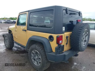2014 Jeep Wrangler Rubicon with VIN 1C4BJWCG4EL145081, listed as a IAAI auction lot 42180723 with 113,659 mi miles and . Bid and sale history available at DreamBid. Image 3.