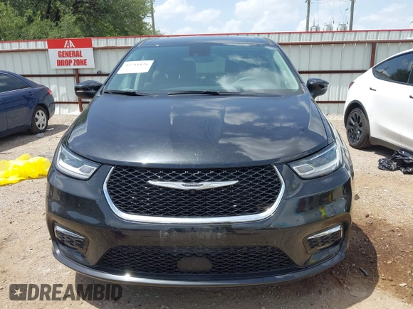 2023 Chrysler Pacifica Hybrid Touring L with VIN 2C4RC1L70PR622000, listed as a IAAI auction lot 42711826 with 65,109 mi miles and . Bid and sale history available at DreamBid. Image 13.