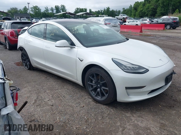 2019 Tesla Model 3 Mid Range z VIN 5YJ3E1EA7KF299755, wystawiony jako IAAI lot #42354352 z przebiegiem Nie podano mil oraz . Historia ofert i sprzedaży dostępna na DreamBid. Obrazek 1.