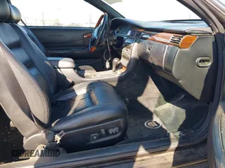 2001 Cadillac Eldorado Touring ETC z VIN 1G6ET12961B100627, wystawiony jako IAAI lot #41458966 z przebiegiem 113 620 mil mil oraz . Historia ofert i sprzedaży dostępna na DreamBid. Obrazek 5.