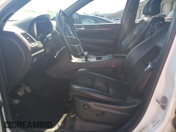 2014 Jeep Grand Cherokee Laredo with VIN 1C4RJFAG5EC568768, listed as a Copart auction lot 49257925 with 217,587 mi miles and Salvage Title. Bid and sale history available at DreamBid. Image 7.