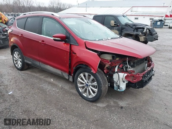 2017 Ford Escape Titanium with VIN 1FMCU9J95HUA48807, listed as a IAAI auction lot 41522636 with 218,342 mi miles. Bid and sale history available at carsss.com. Image 1.
