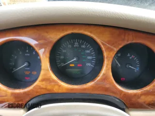 1999 Jaguar XJ with VIN SAJHX1044XC865054, listed as a Copart auction lot 57825325 with 71,145 mi miles and Clean title. Bid and sale history available at DreamBid. Image 9.