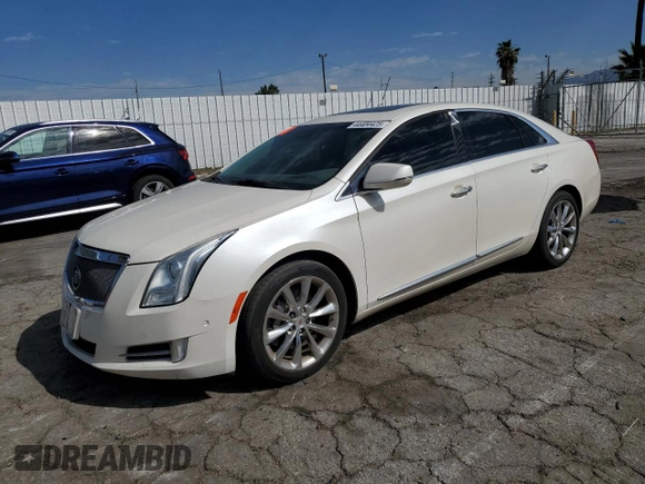2014 Cadillac XTS Premium with VIN 2G61P5S36E9305491, listed as a Copart auction lot 44404425 with 104,710 mi miles and Salvage Title. Bid and sale history available at DreamBid. Image 1.
