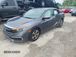 2020 Honda Civic LX z VIN 19XFC2F66LE012481, wystawiony jako IAAI lot #42297600 z przebiegiem 56 602 mil mil oraz . Historia ofert i sprzedaży dostępna na DreamBid. Obrazek 2.