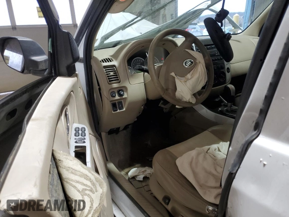 2005 Mercury Mariner Luxury z VIN 4M2CU57145DJ11612, wystawiony jako Copart lot #43980985 z przebiegiem 102 859 mil mil oraz Szkody całkowita. Historia ofert i sprzedaży dostępna na DreamBid. Obrazek 8.