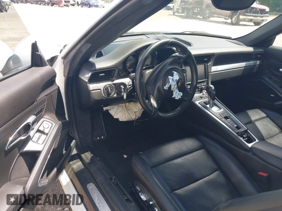 2014 Porsche 911 Carrera S z VIN WP0CB2A97ES154099, wystawiony jako IAAI lot #42264557 z przebiegiem 89 991 mil mil oraz . Historia ofert i sprzedaży dostępna na DreamBid. Obrazek 5.