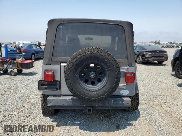 2001 Jeep Wrangler Sport с VIN 1J4FA49S41P353878, выставлен на аукционе Copart как лот 64637385 с пробегом 166 642 миль миль и Списание • Salvage title. История ставок и продаж доступна на DreamBid. Изображение 6.