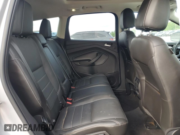 2015 Ford Escape Titanium с VIN 1FMCU9J99FUC33052, выставлен на аукционе Copart как лот 56508365 с пробегом Не указан миль и На запчасти • Non repairable. История ставок и продаж доступна на DreamBid. Изображение 11.