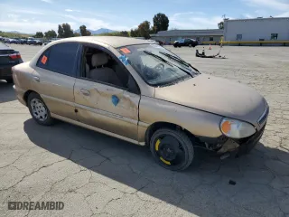 2002 Kia Rio with VIN KNADC123826190150, listed as a Copart auction lot 52949735 with 139,234 mi miles and Clean Title. Bid and sale history available at carsss.com. Image 4.