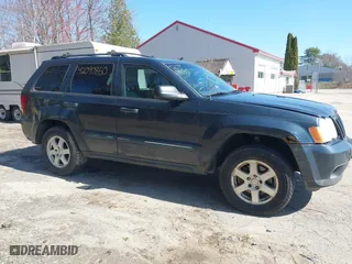 2008 Jeep Grand Cherokee Laredo with VIN 1J8GR48K98C161239, listed as a IAAI auction lot 42090850 with 218,063 mi miles. Bid and sale history available at carsss.com. Image 14.