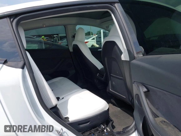 2023 Tesla Model Y Long Range with VIN 7SAYGAEEXPF776370, listed as a IAAI auction lot 42127512 with 27,120 mi miles and . Bid and sale history available at DreamBid. Image 8.