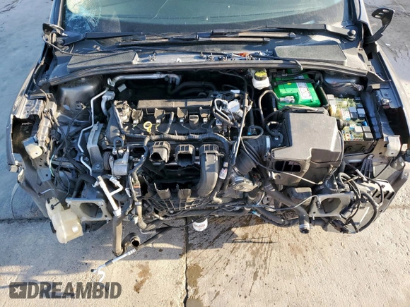2018 Ford Focus SE z VIN 1FADP3F2XJL256272, wystawiony jako Copart lot #52651675 z przebiegiem 37 897 mil mil oraz Szkody całkowita. Historia ofert i sprzedaży dostępna na DreamBid. Obrazek 11.