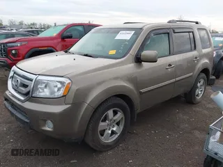 2011 Honda Pilot EX-L with VIN 5FNYF4H51BB076050, listed as a IAAI auction lot 42122883 with 143,288 mi miles and . Bid and sale history available at carsss.com. Image 2.