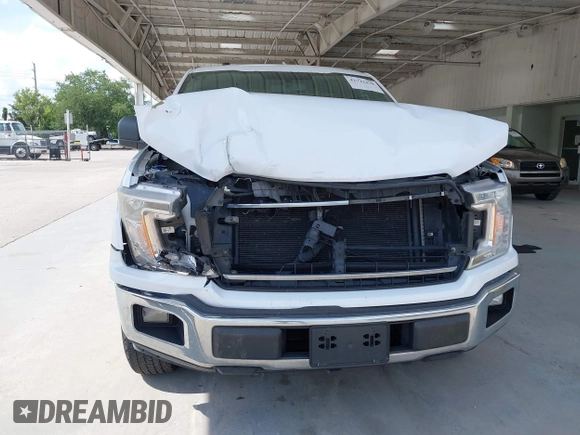 2018 Ford F-150 XL with VIN 1FTMF1CP7JKE12307, listed as a IAAI auction lot 42722428 with 228,606 mi miles and . Bid and sale history available at DreamBid. Image 12.