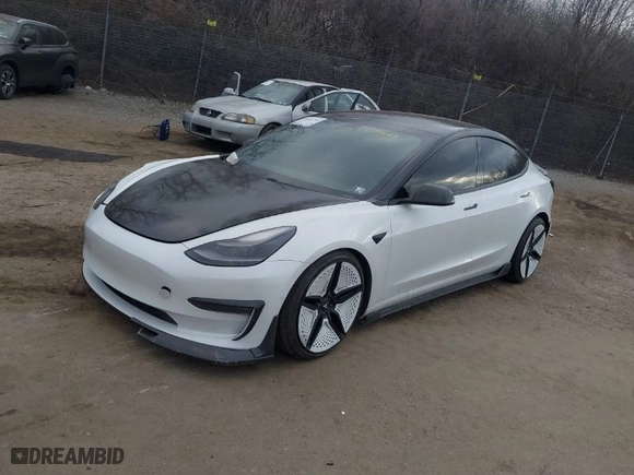 2021 Tesla Model 3 Performance with VIN 5YJ3E1EC5MF059625, listed as a IAAI auction lot 41652748 with 63,287 mi miles. Bid and sale history available at carsss.com. Image 2.