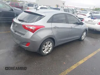 2014 Hyundai Elantra GT with VIN KMHD35LH1EU215003, listed as a IAAI auction lot 42154051 with 109,759 mi miles. Bid and sale history available at carsss.com. Image 4.