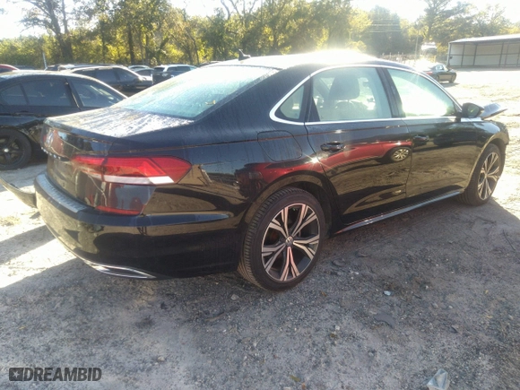 2021 Volkswagen Passat 2.0T SE with VIN 1VWSA7A34MC014993, listed as a IAAI auction lot 40556424 with 64,508 mi miles. Bid and sale history available at carsss.com. Image 4.