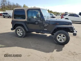 1999 Jeep Wrangler Sport z VIN 1J4FY19SXXP465037, wystawiony jako Copart lot #54772405 z przebiegiem 50 942 mil mil oraz Nie do naprawy • Non repairable. Historia ofert i sprzedaży dostępna na DreamBid. Obrazek 4.