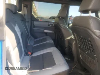 2023 Ford Bronco z VIN 1FMEE5BP9PLC15220, wystawiony jako Copart lot #41729435 z przebiegiem 10 855 mil mil oraz Szkoda całkowita • Salvage title. Historia ofert i sprzedaży dostępna na DreamBid. Obrazek 11.