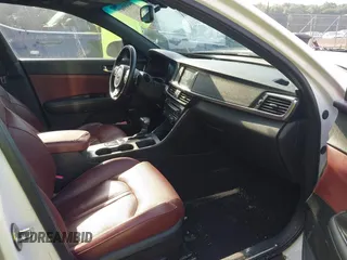 2017 Kia Optima SX z VIN 5XXGW4L26HG125516, wystawiony jako IAAI lot #42483007 z przebiegiem 152 400 mil mil oraz . Historia ofert i sprzedaży dostępna na DreamBid. Obrazek 5.