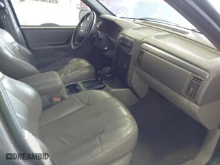 2001 Jeep Grand Cherokee Laredo with VIN 1J4GW48S91C525711, listed as a IAAI auction lot 42048952 with 1 mi miles. Bid and sale history available at carsss.com. Image 5.