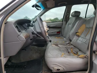 1999 Mercury Grand Marquis LS z VIN 2MEFM75W3XX617388, wystawiony jako Copart lot #58811195 z przebiegiem 162 600 mil mil oraz Szkoda całkowita • Salvage title. Historia ofert i sprzedaży dostępna na DreamBid. Obrazek 7.