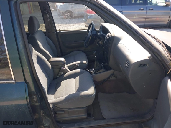 2002 Kia Sportage with VIN KNDJA723425144951, listed as a IAAI auction lot 42049262 with 149,793 mi miles. Bid and sale history available at carsss.com. Image 5.