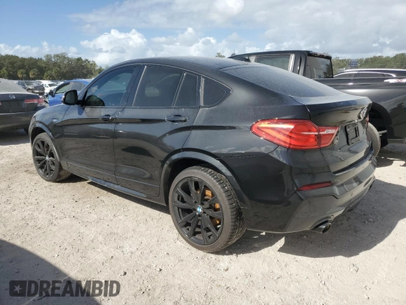 2017 BMW X4 M40i with VIN 5UXXW7C51H0U25766, listed as a Copart auction lot 77749324 with 101,289 mi miles and Salvage Title. Bid and sale history available at carsss.com. Image 2.