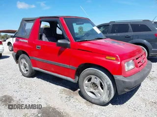 1998 Chevrolet Tracker z VIN 2CNBE1866W6924835, wystawiony jako IAAI lot #41821459 z przebiegiem 54 512 mil mil oraz . Historia ofert i sprzedaży dostępna na DreamBid. Obrazek 1.