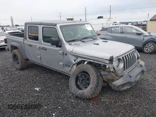 2020 Jeep Gladiator Sport S z VIN 1C6HJTAG8LL130311, wystawiony jako IAAI lot #41807200 z przebiegiem 30 439 mil mil oraz . Historia ofert i sprzedaży dostępna na DreamBid. Obrazek 1.