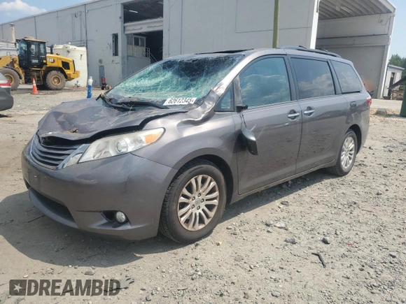 2015 Toyota Sienna XLE with VIN 5TDYK3DC6FS576670, listed as a Copart auction lot 62612345 with 106,475 mi miles and Salvage title. Bid and sale history available at DreamBid. Image 1.