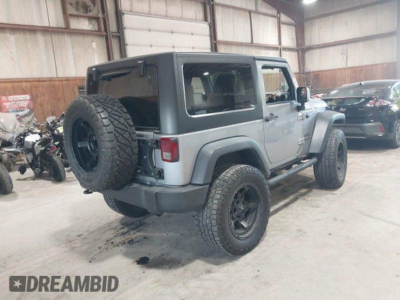 2014 Jeep Wrangler Sport with VIN 1C4AJWAG0EL173362, listed as a IAAI auction lot 42231863 with 99,321 mi miles and . Bid and sale history available at DreamBid. Image 4.