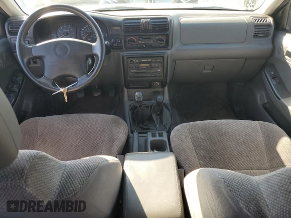 1999 Isuzu Rodeo S with VIN 4S2CM58W0X4306727, listed as a Copart auction lot 74758994 with 193,850 mi miles and Clean title. Bid and sale history available at DreamBid. Image 8.