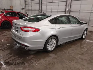 2016 Ford Fusion SE Hybrid z VIN 3FA6P0LU1GR304166, wystawiony jako IAAI lot #41932720 z przebiegiem 68 058 mil mil oraz . Historia ofert i sprzedaży dostępna na DreamBid. Obrazek 4.