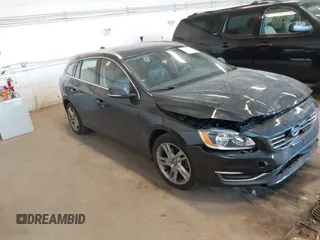 2015 Volvo V60 T5 Drive-E Premier with VIN YV140MEKXF1258073, listed as a IAAI auction lot 41428244 with 57,699 mi miles. Bid and sale history available at carsss.com. Image 1.