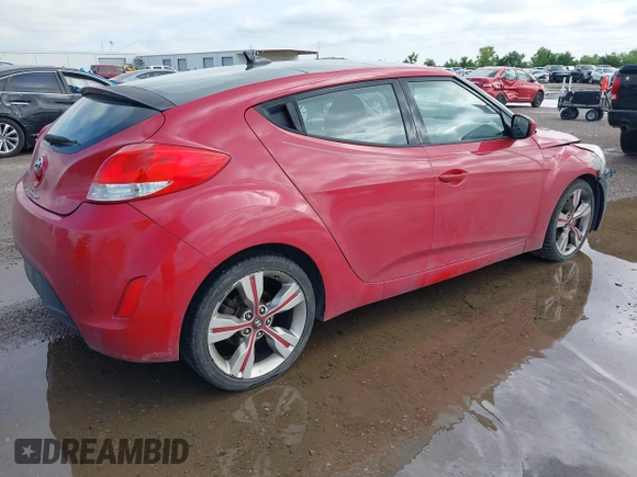 2015 Hyundai Veloster z VIN KMHTC6AD8FU227474, wystawiony jako IAAI lot #42188164 z przebiegiem 122 485 mil mil oraz . Historia ofert i sprzedaży dostępna na DreamBid. Obrazek 4.