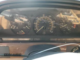 1987 Mercedes-Benz 420 with VIN WDBCA35D0HA311262, listed as a Copart auction lot 71760554 with 185,520 mi miles and Salvage Title. Bid and sale history available at carsss.com. Image 9.