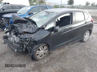 2017 Honda Fit LX with VIN JHMGK5H53HS006718, listed as a IAAI auction lot 41482503 with 77,164 mi miles. Bid and sale history available at carsss.com. Image 2.