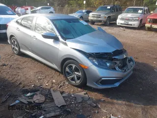 2020 Honda Civic LX z VIN 2HGFC2F60LH549739, wystawiony jako IAAI lot #40922240 z przebiegiem 127 958 mil mil oraz . Historia ofert i sprzedaży dostępna na DreamBid. Obrazek 1.