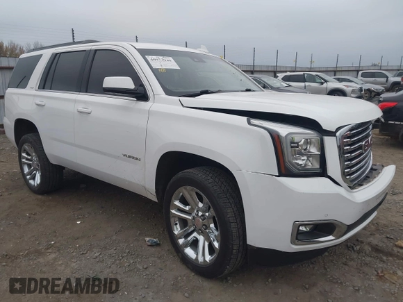 2018 GMC Yukon SLT with VIN 1GKS1BKC3JR279163, listed as a IAAI auction lot 40973940 with 122,445 mi miles. Bid and sale history available at carsss.com. Image 1.