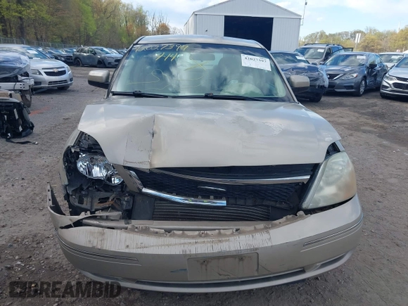 2005 Ford Five Hundred SE z VIN 1FAFP23115G121341, wystawiony jako IAAI lot #42027397 z przebiegiem 110 851 mil mil oraz . Historia ofert i sprzedaży dostępna na DreamBid. Obrazek 13.