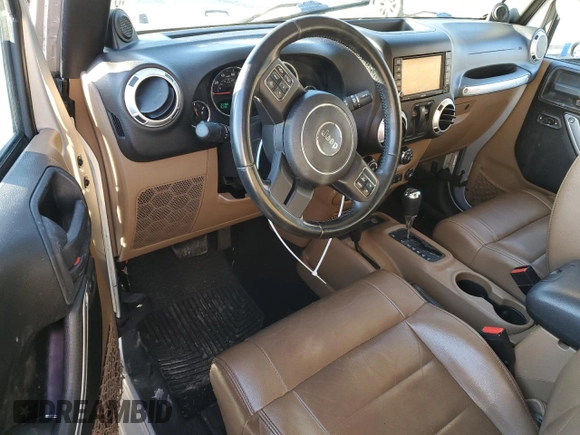 2011 Jeep Wrangler Sahara with VIN 1J4GA5D14BL628876, listed as a Copart auction lot 87317374 with 84,179 mi miles and Salvage Title. Bid and sale history available at DreamBid. Image 8.