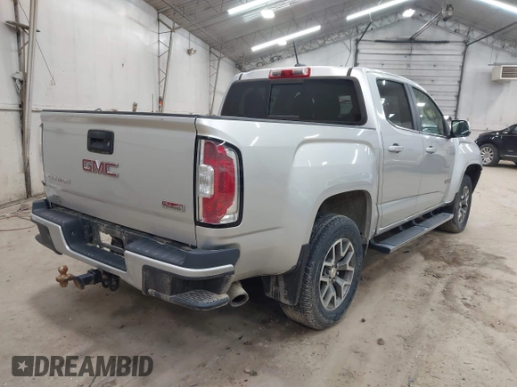 2015 GMC Canyon 4WD SLE z VIN 1GTG6BE39F1252926, wystawiony jako IAAI lot #42128396 z przebiegiem 113 139 mil mil oraz . Historia ofert i sprzedaży dostępna na DreamBid. Obrazek 4.