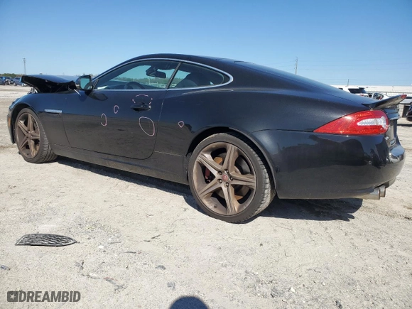2015 Jaguar XK with VIN SAJWA4DCXFMB55227, listed as a Copart auction lot 48455465 with 64,050 mi miles and Salvage Title. Bid and sale history available at carsss.com. Image 2.