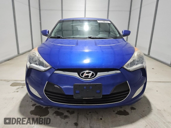2013 Hyundai Veloster w/Black Int z VIN KMHTC6AD2DU125066, wystawiony jako Copart lot #60921325 z przebiegiem 189 503 mil mil oraz Czysty tytuł • Clean title. Historia ofert i sprzedaży dostępna na DreamBid. Obrazek 5.
