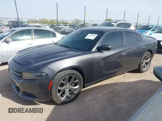 2015 Dodge Charger SXT with VIN 2C3CDXHG4FH890684, listed as a IAAI auction lot 41896958 with 118,140 mi miles and . Bid and sale history available at DreamBid. Image 2.