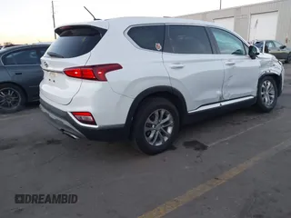 2019 Hyundai Santa Fe SE z VIN 5NMS23AD9KH077362, wystawiony jako IAAI lot #41890584 z przebiegiem 132 476 mil mil oraz . Historia ofert i sprzedaży dostępna na DreamBid. Obrazek 4.