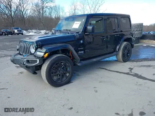 2023 Jeep Wrangler 4xe Sahara with VIN 1C4JJXP62PW613040, listed as a IAAI auction lot 41489171 with 36,818 mi miles. Bid and sale history available at carsss.com. Image 22.