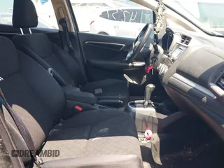 2015 Honda Fit LX z VIN 3HGGK5H56FM712266, wystawiony jako IAAI lot #42378228 z przebiegiem 140 423 mil mil oraz . Historia ofert i sprzedaży dostępna na DreamBid. Obrazek 5.